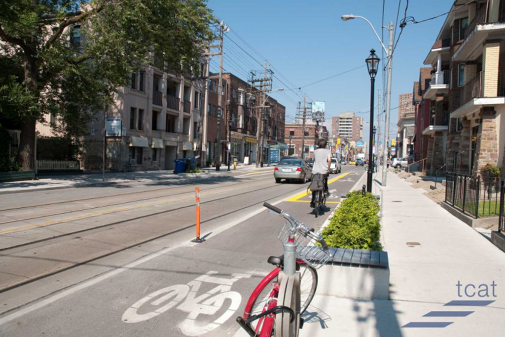 Trees and planters used to protect bike lanes