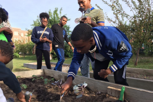 Youth helping to plant a community garden in Macon, Georgia.