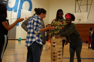 Youth play a giant game of Jenga at a SuperSize Me event.