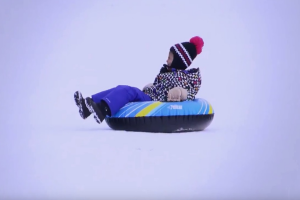 Kid-sliding-in-the-snow