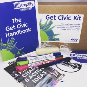 Get Civic handbook, box kit, markers, and supplies on a table