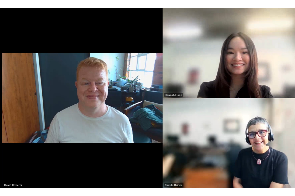 Screenshot of a virtual meeting showing three participants in a video conferencing layout. One participant appears in a large window on the left, while two participants appear in smaller stacked windows on the right. The participants are seated indoors with home or office backgrounds.